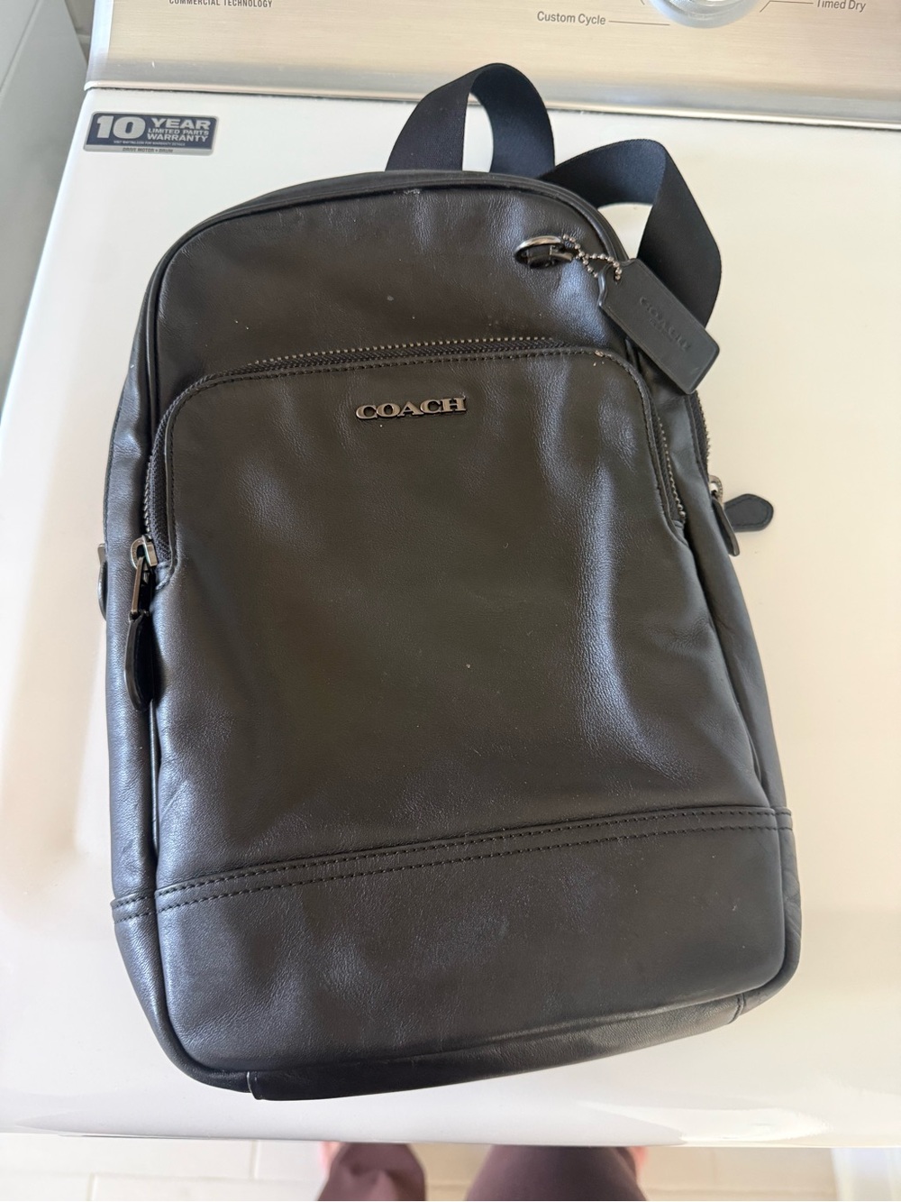 Coach Men’s Black Leather Sling Backpack